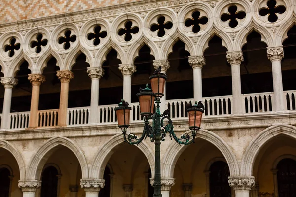 Italy. Venice. The old street lamp on the background of the Doge\'s Palace in St. Mark\'s Square.