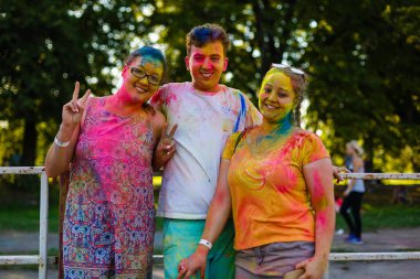 Kiev, UKRAINE - August 13, 2017: Celebrants at the color Holi Festival clipart