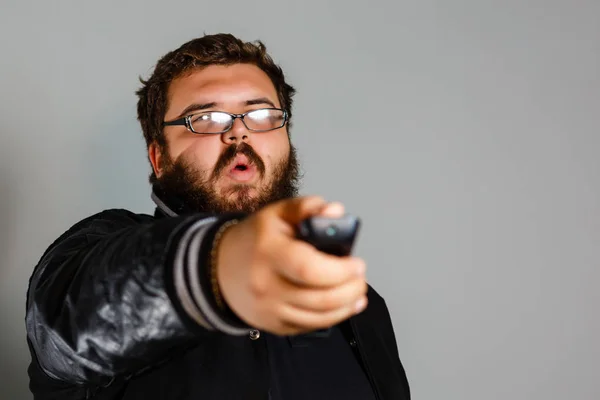 Nervous Man Holding Remote Control Try Watching Isolated Gray Background — Stock Photo, Image