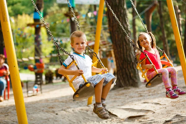 Smiling Little Girl Boy Swing Children Playing Outdoors Summer — Stock Photo, Image