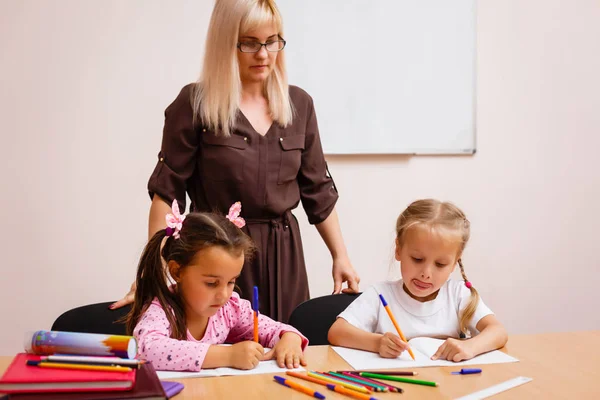 Two Happy Little Schoolgirls Studying Class Teacher — Stock Photo, Image