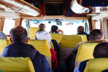 people in bus back view
