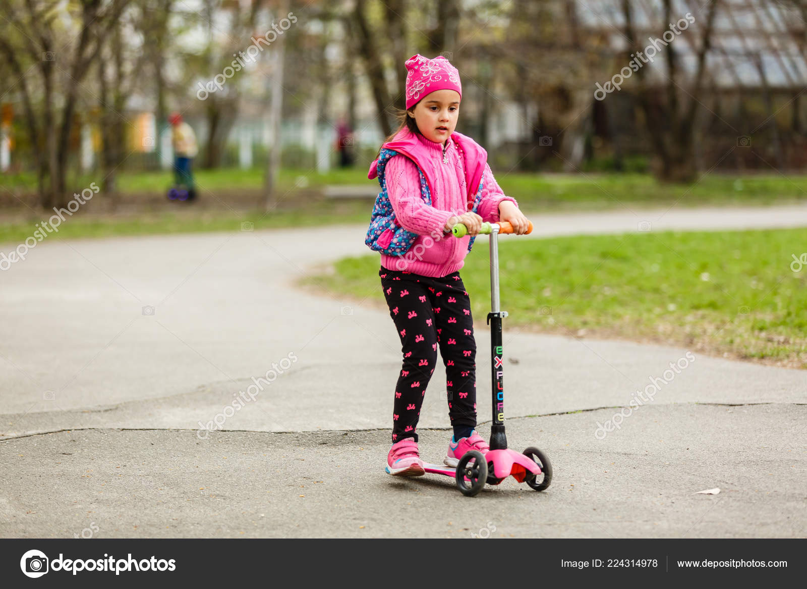 girl riding a scooter