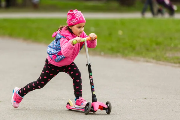 Little Girl Pink Coat Riding Scooter Park — Stock Photo, Image