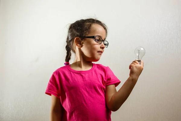 Portrait Little Girl Holding Light Bulb White Background — Stock Photo, Image