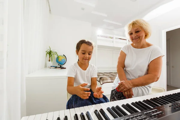 Music Teacher Showing Girl How Play Piano — Stock Photo, Image