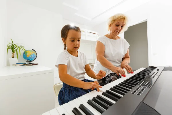 Music Teacher Showing Girl How Play Piano — Stock Photo, Image