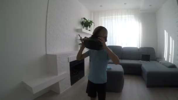 Young Boy Using Virtual Reality Goggles Living Room — Stock Video