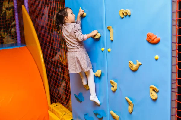 Cheerful Girl Playing Colorful Creche — Stock Photo, Image