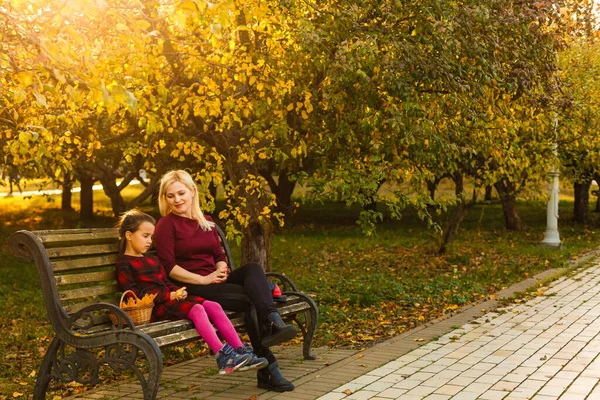Happy Mother Daughter Embracing Bench Autumn Park — Stock Photo, Image