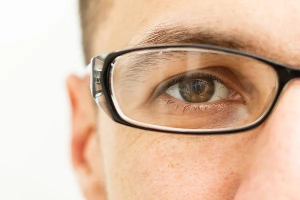 Young Man Puts His Glasses — Stock Photo, Image