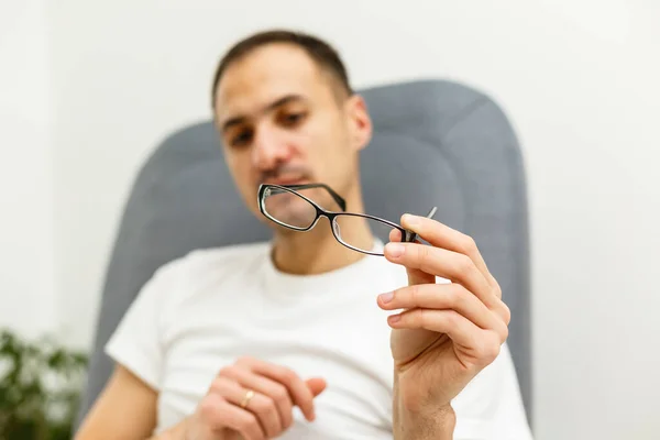 Young Man Puts His Glasses — Stock Photo, Image