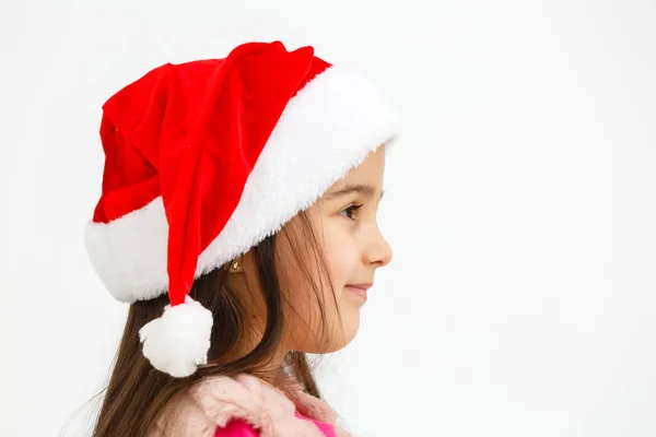 모자를 크리스마스 여학생의 사진하얀 배경에 고립된 미소짓고 — 스톡 사진