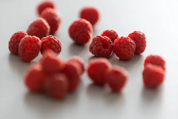 Red Raspberry fruit on gray background chocolate — Stock Photo, Image