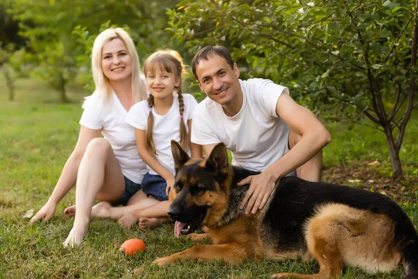 Portrait Extended Family Pet Dog Sitting Park Stock Photo