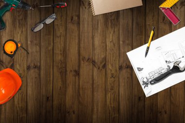 Mimarlığın işyeri - mimarlık projesi, planlar, planlar, planlı kalem. Mühendislik aletleri ve aletler yukarıdan görünüyor. İnşaat arkaplanı.