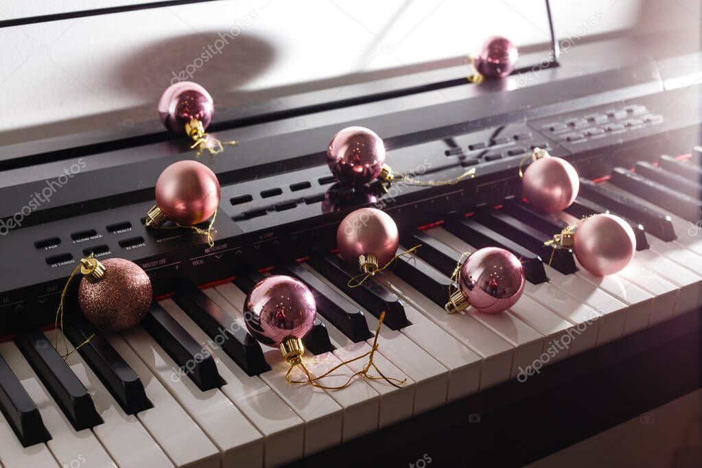 A piano with christmas lights and tree