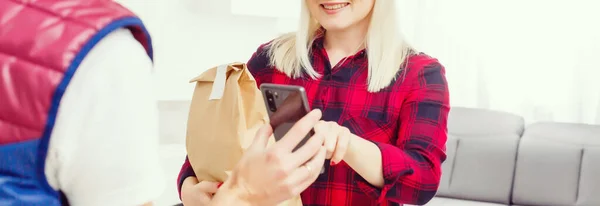 Man food delivery in an apartment