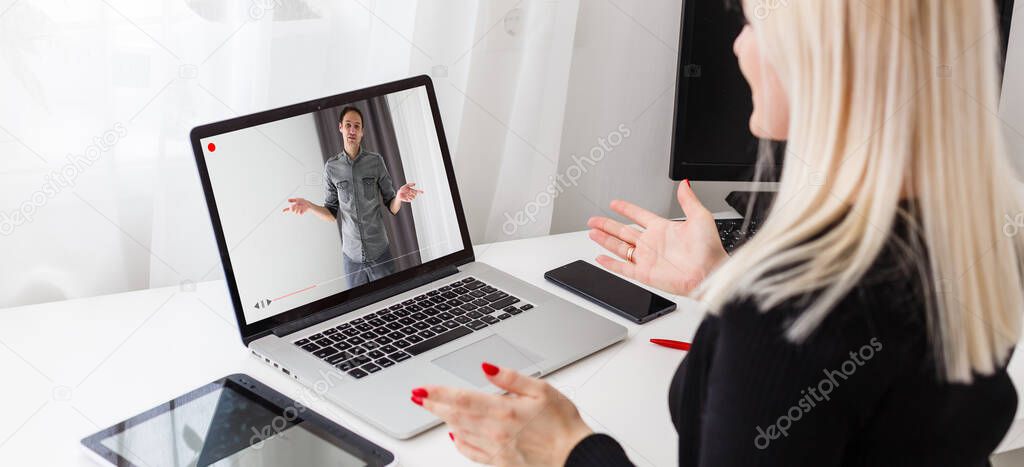 Close-up Of Businesswoman Video Conferencing With Colleague On Laptop