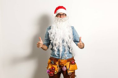 İnşaat aletleriyle Noel Baba, Noel Baba tamircisi.