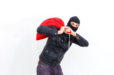 Thief robbed bank and is carrying full bag of money. Isolated on white background. clipart