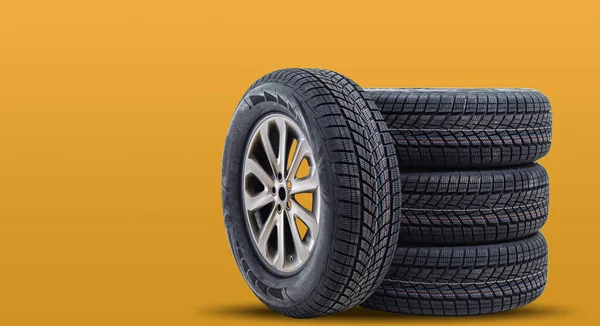 Car Tires Isolated Yellow Background — Stock Photo, Image