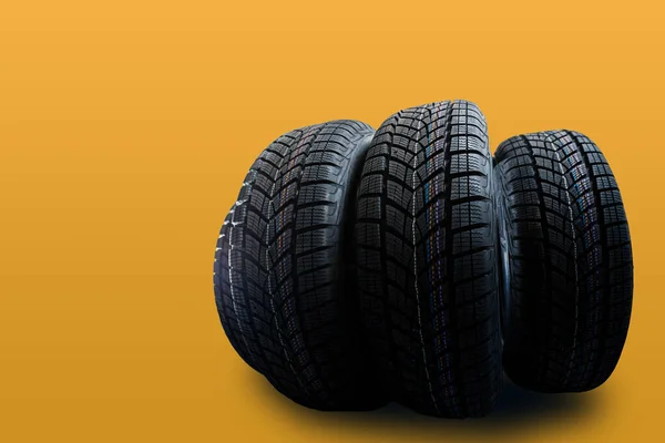 Car tires isolated on yellow background