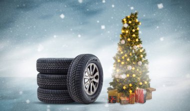 Noel arkaplanında Noel hediyesi olarak tekerlek lastiği