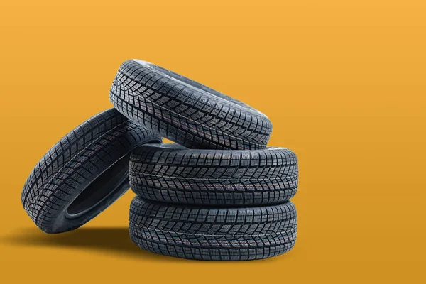 Car tires isolated on yellow background