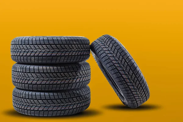 Car tires isolated on yellow background
