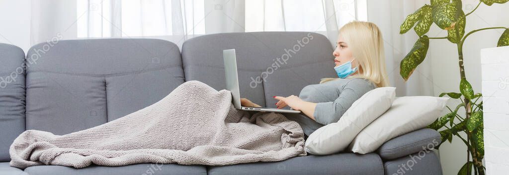 Panoramic shot of girl watching laptop while laying in bed with copy space