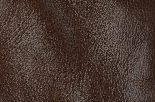 自然な茶色の革の背景のクローズアップ — ストック写真