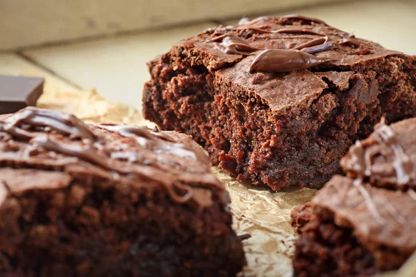 Close up of homemade fudge brownies over wooden background