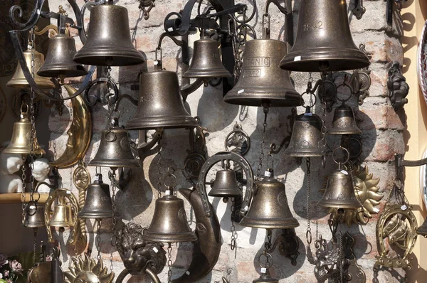 bronze bells in a souvenir shop in Sirmione, Italy