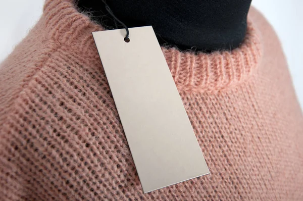 空白のラベル付きニット桃セーターの一部 ストック画像