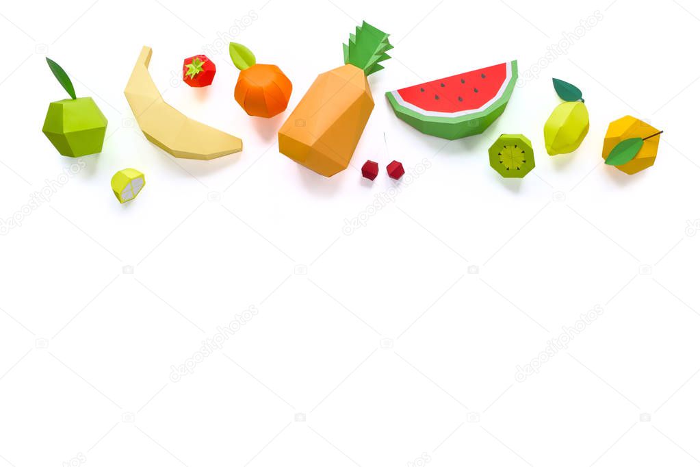 exotic fruits made of paper on white background