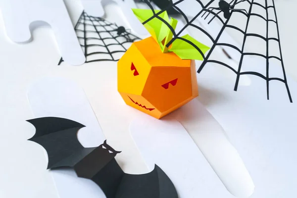 Happy Halloween. Halloween decor made of paper. Pumpkin made of paper