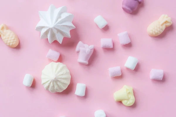 Pastel food set of colorful marshmallow on pink background. Dessert, minimalistic design.