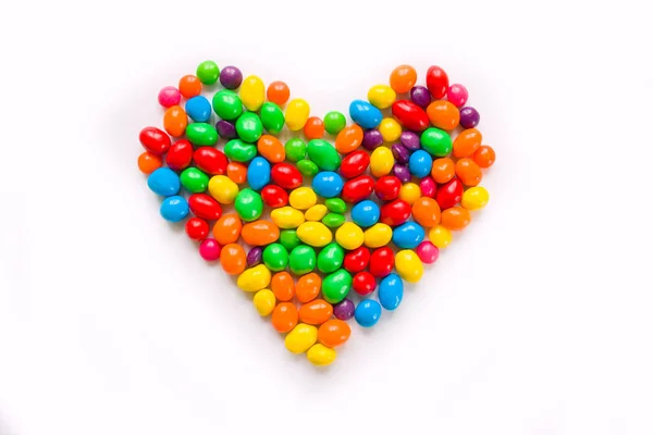 Barevné Bonbóny Uspořádané Jako Srdce Bílém Podkladu Sladké Cukroví Stock Obrázky