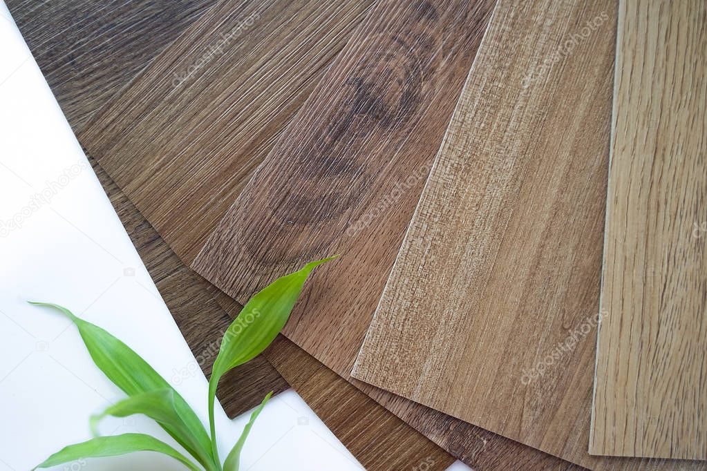Samples of laminate make a new floor for renovate or new floor in the house or the building or commercial building on white background with bamboo.
