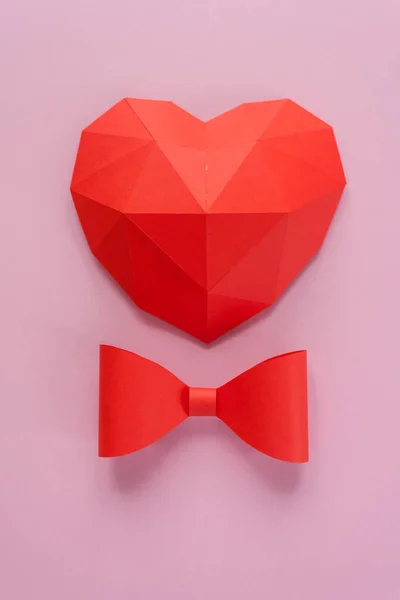 Paper hearth with shadow. Red polygonal paper heart for Valentine\'s day or any other Love invitation cards.