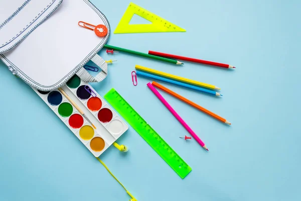 Creative school bag made of paper with school stationery.