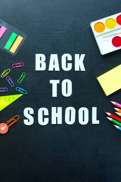 School supplies on blackboard background. Back to school concept — Stock Photo, Image