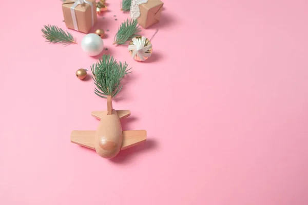 Wooden children's plane on a pink background — Stock Photo, Image