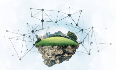 Gökyüzünde yükselen çimen ve şehir manzaralı güzel küçük bir ada.