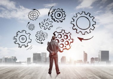 Modern şehre bakan ve vites düzeneği çizen işadamlarının arka planı