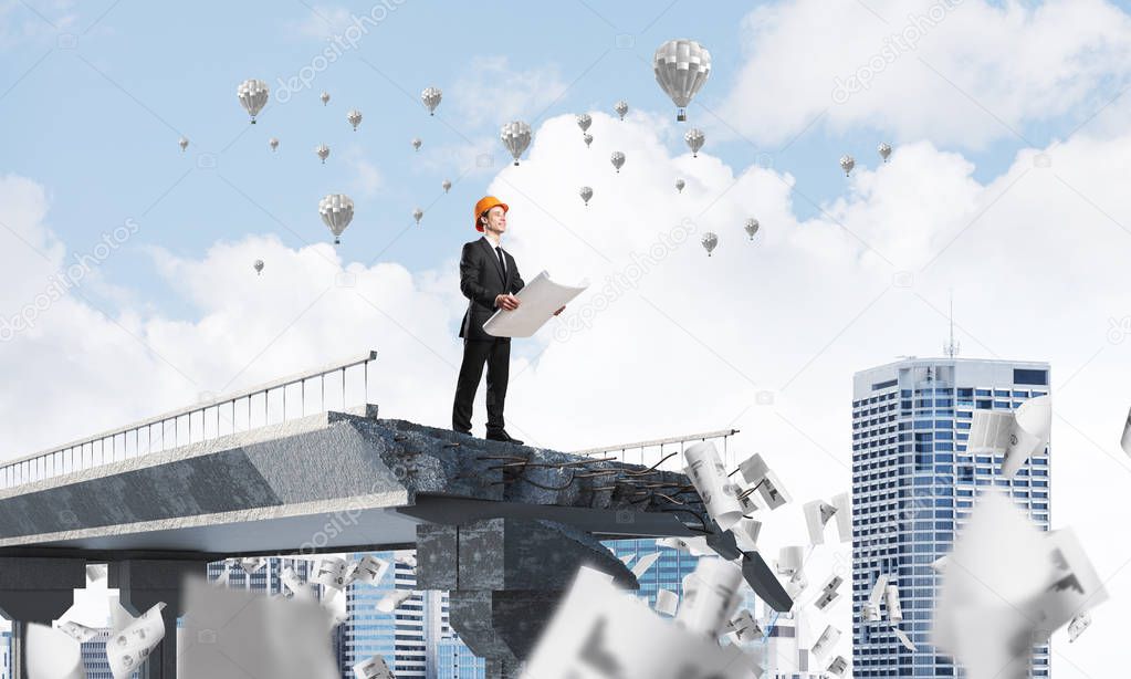 Confident engineer in helmet keeping drawing in hands while standing among flying papers on broken bridge with flying balloons on background. 3D rendering.