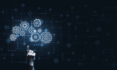 İş adamının eli dişli mekanizmasını işaret ediyor.