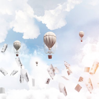 Renkli aerostats kağıt belgeler arasında ve mavi bulutlu gökyüzü üzerinde uçan. 3D render.