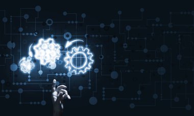 İş adamının eli dişli mekanizmasını işaret ediyor.